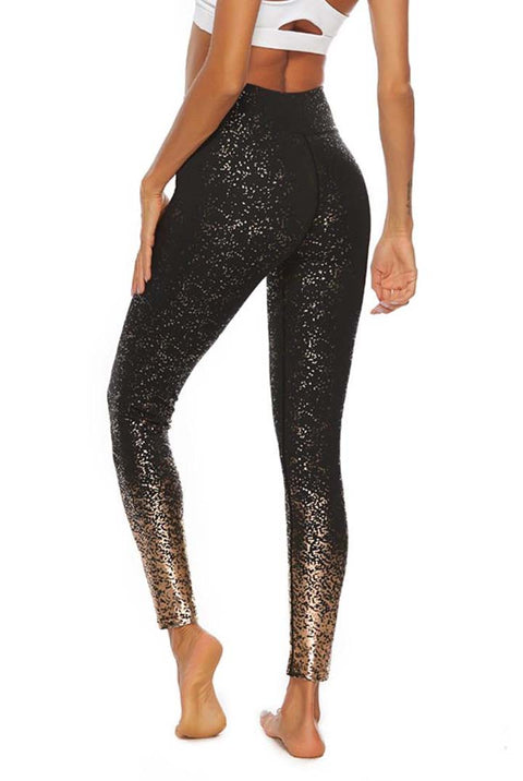 Sport Legging zwart met gouden spots. Lagere tailleband.