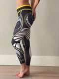 Sportlegging, yoga legging met abstract blad design in zwart, wit en gele kleurcombinatie